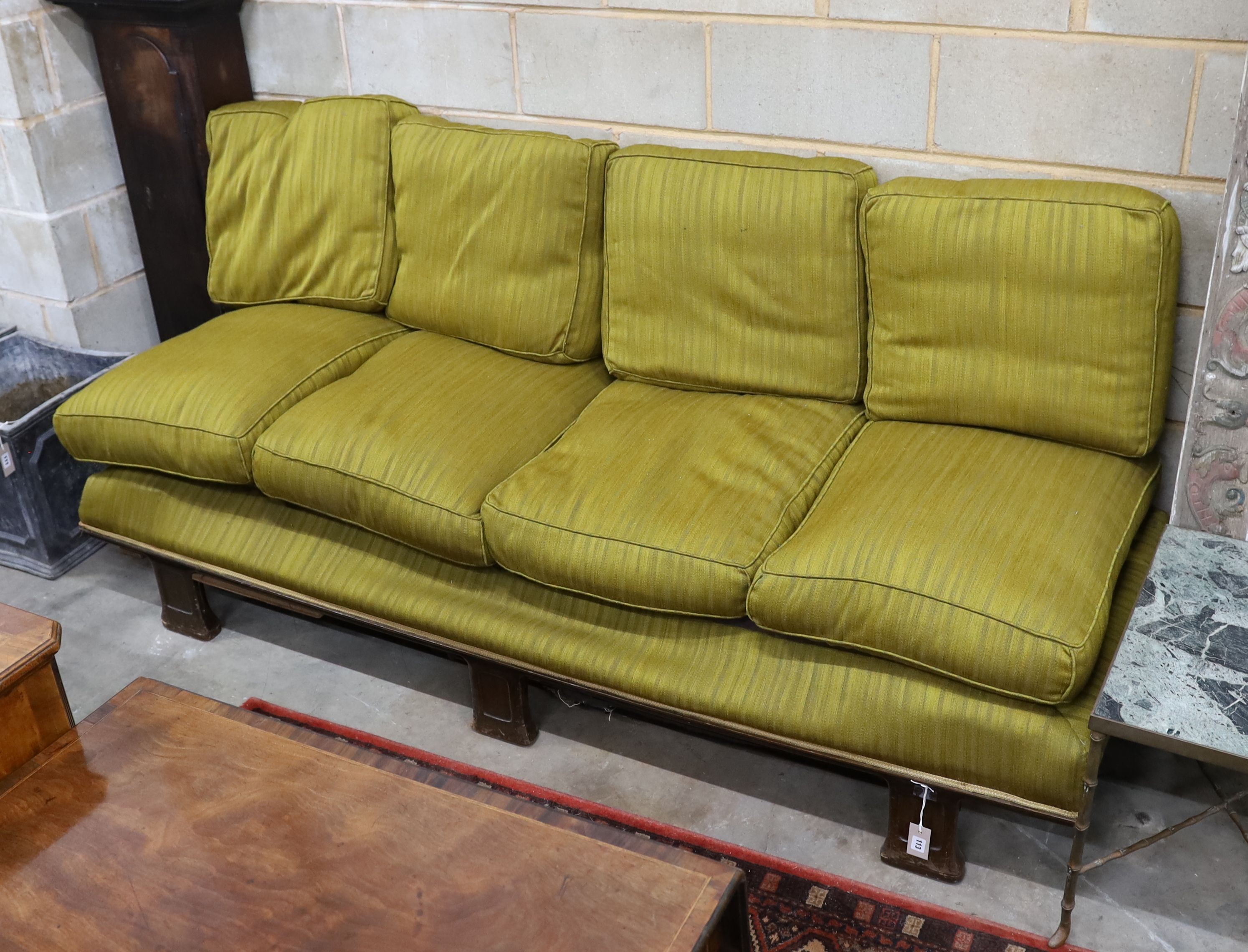 An early 20th century Continental mahogany day bed with loose cushion upholstery, length 200cm, depth 76cm